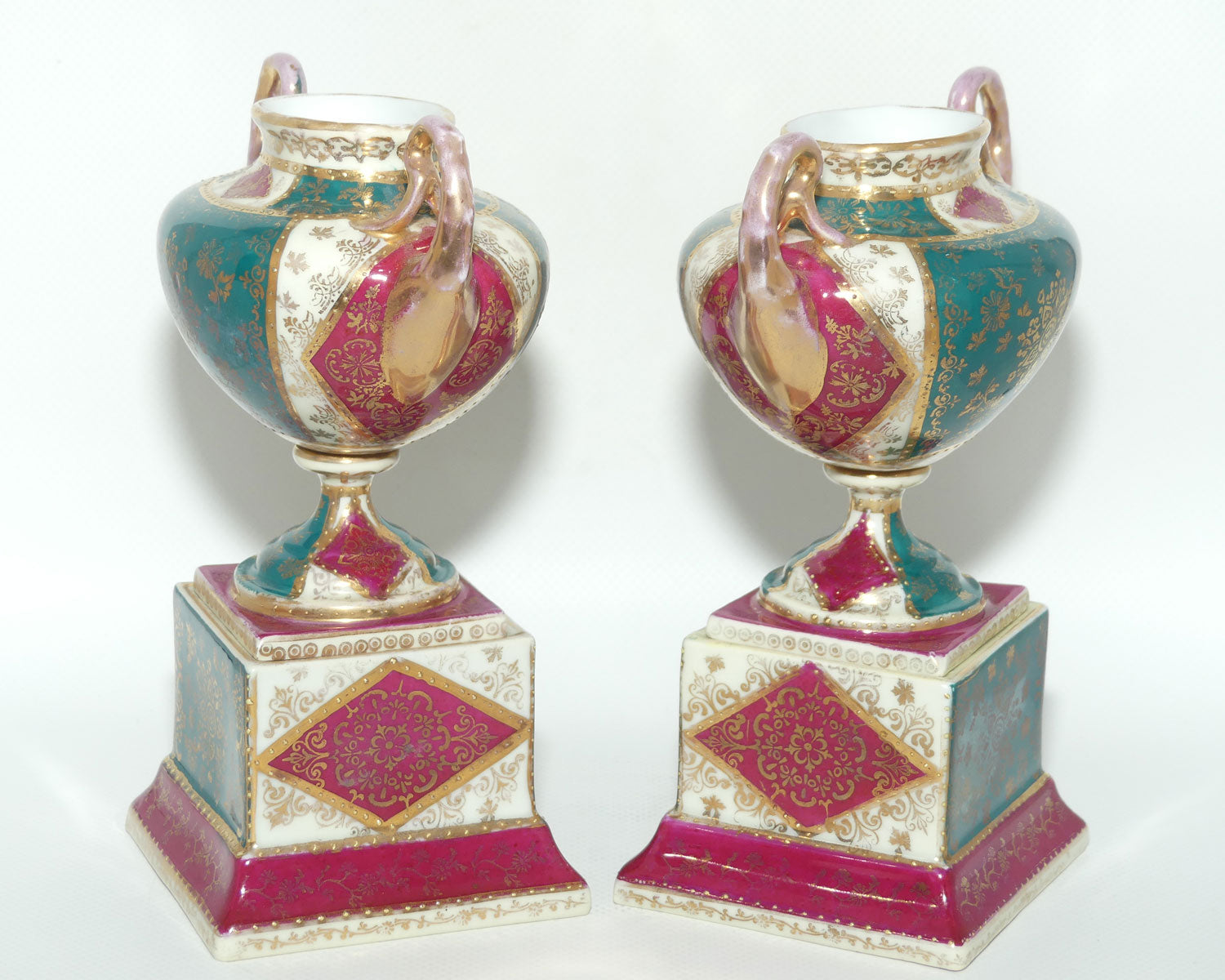 Royal Vienna pair of smaller twin handle cabinet vases on plinths
