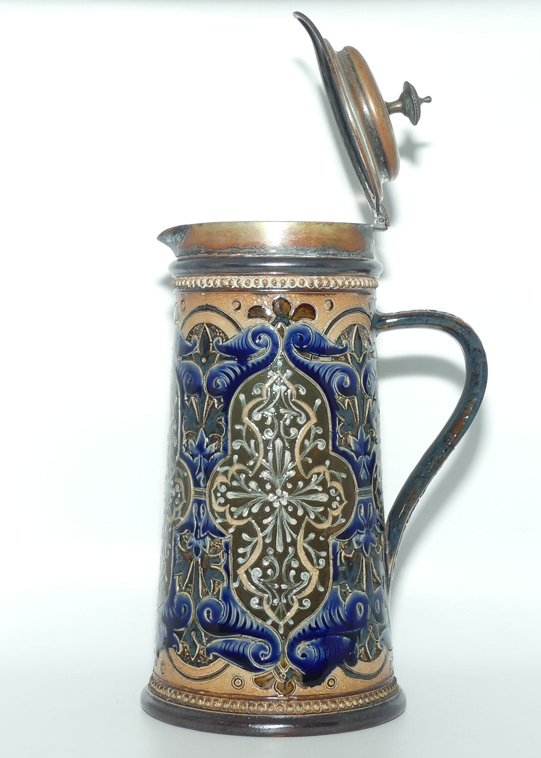 Doulton Lambeth stoneware lidded ale jug with pate-sur-pate cartouches and incised scrollwork  (Parker)