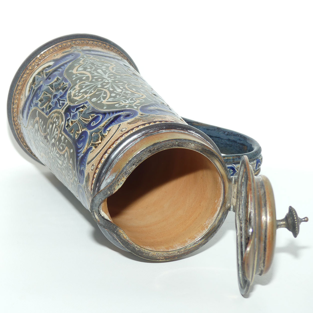 Doulton Lambeth stoneware lidded ale jug with pate-sur-pate cartouches and incised scrollwork  (Parker)