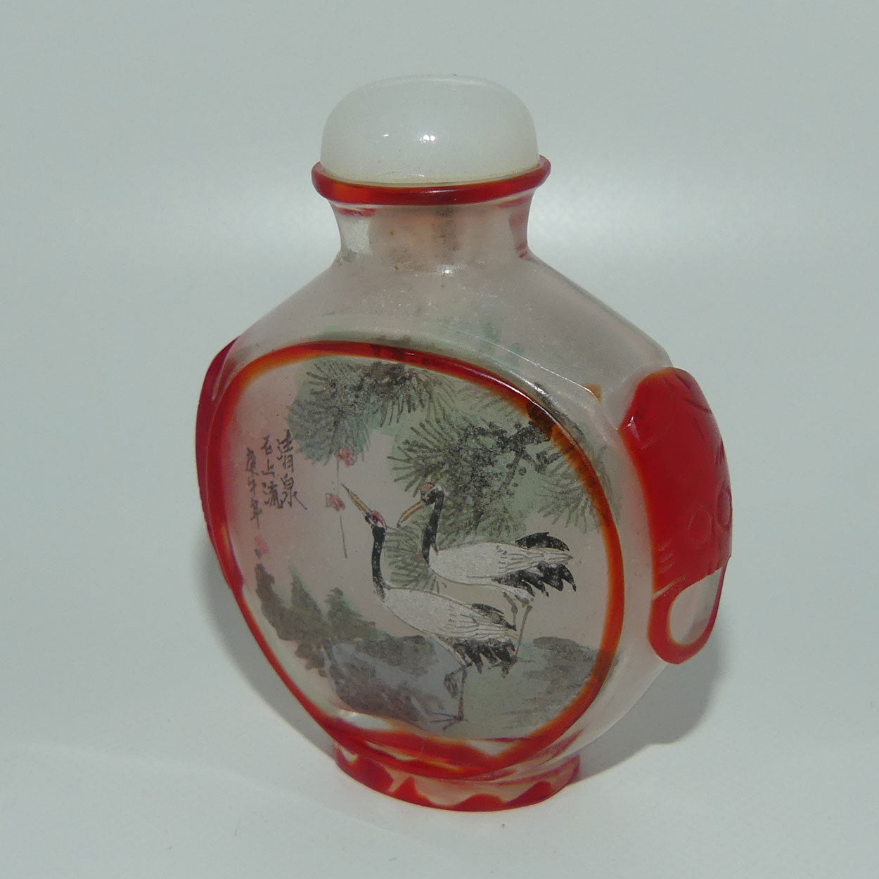 Peking Glass Red and Clear Reverse Painted double scene Snuff Bottle