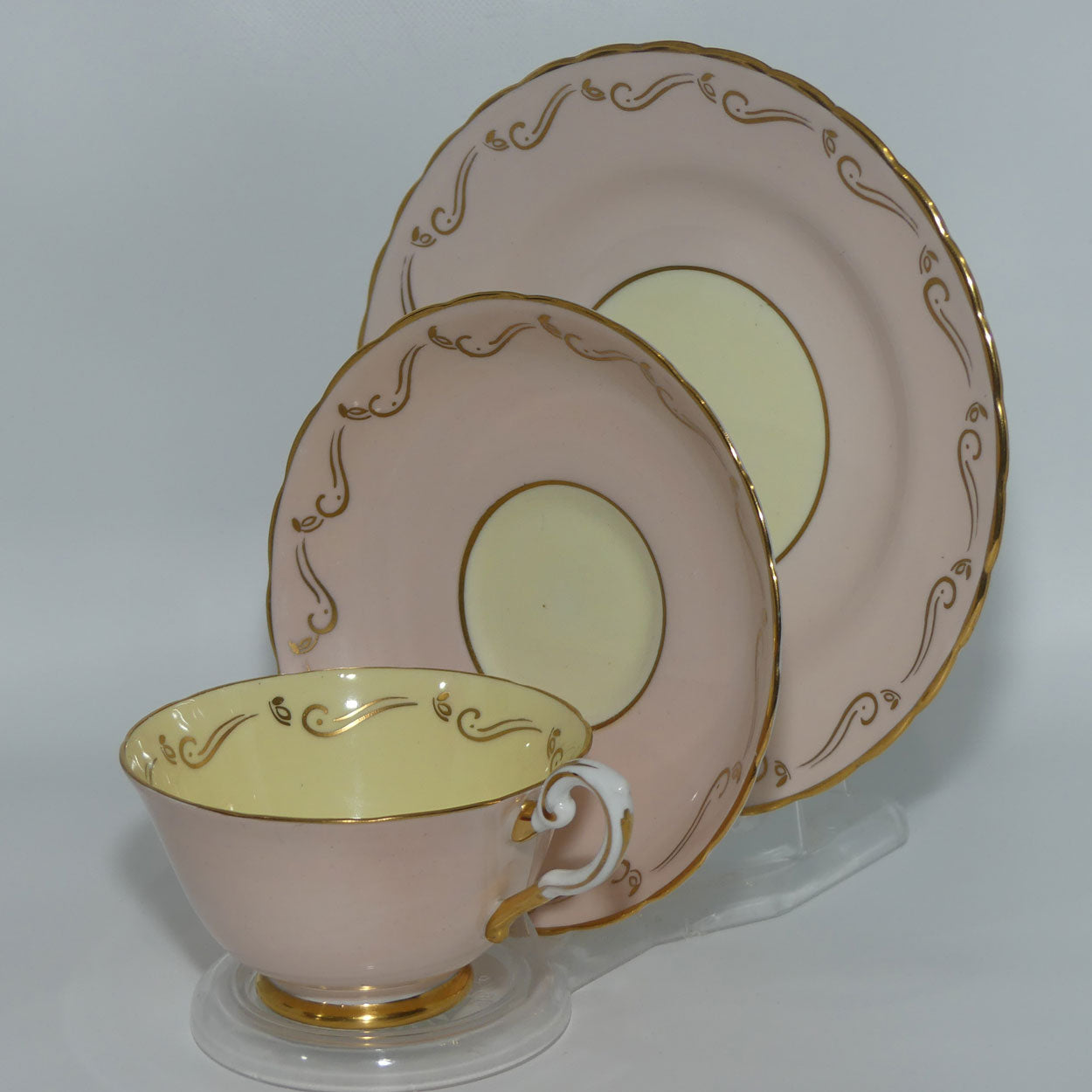 Tuscan Fine English Bone China Pink and Gilt Swirl trio | Fancy handle | Yellow Interior