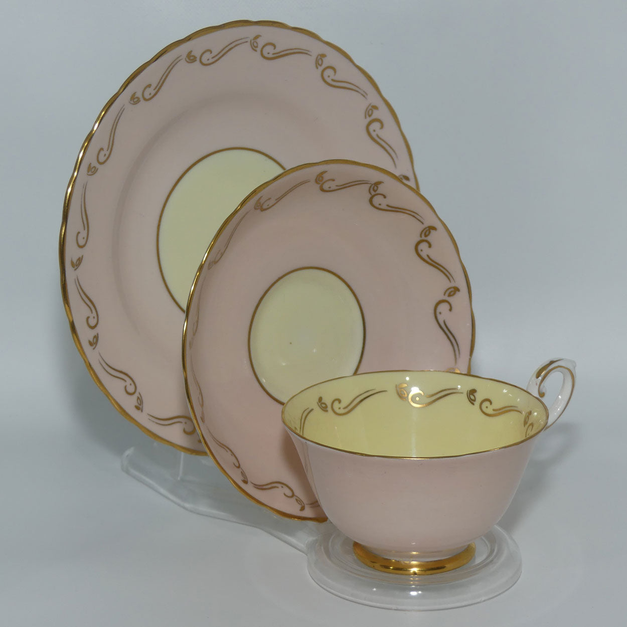 Tuscan Fine English Bone China Pink and Gilt Swirl trio | Fancy handle | Yellow Interior