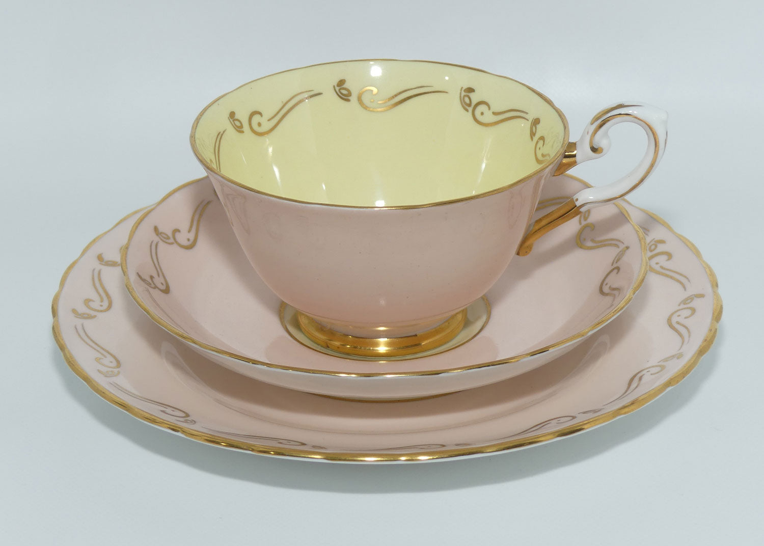 Tuscan Fine English Bone China Pink and Gilt Swirl trio | Fancy handle | Yellow Interior