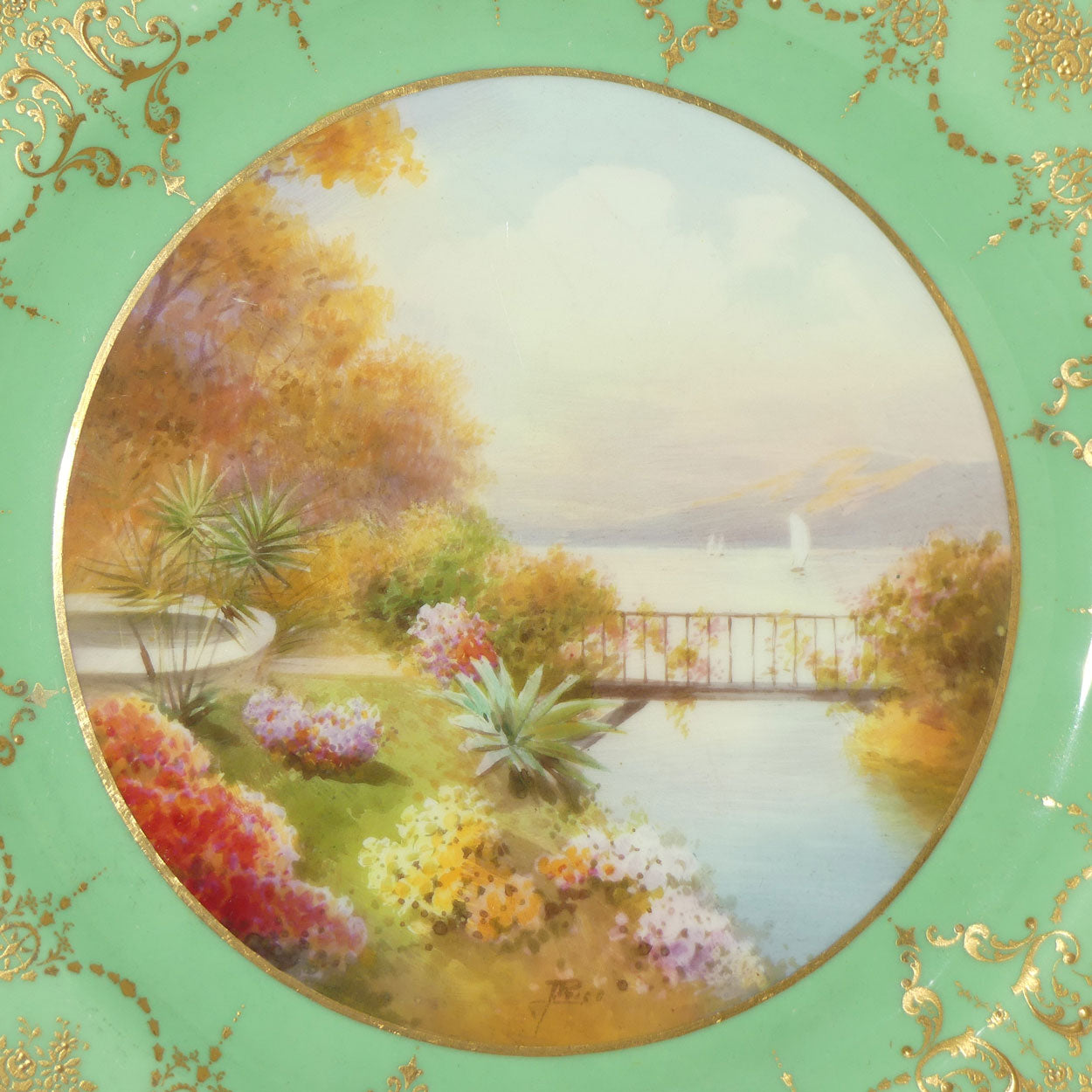 Royal Doulton hand painted and gilt Lake, Bridge & Garden plate (Price)