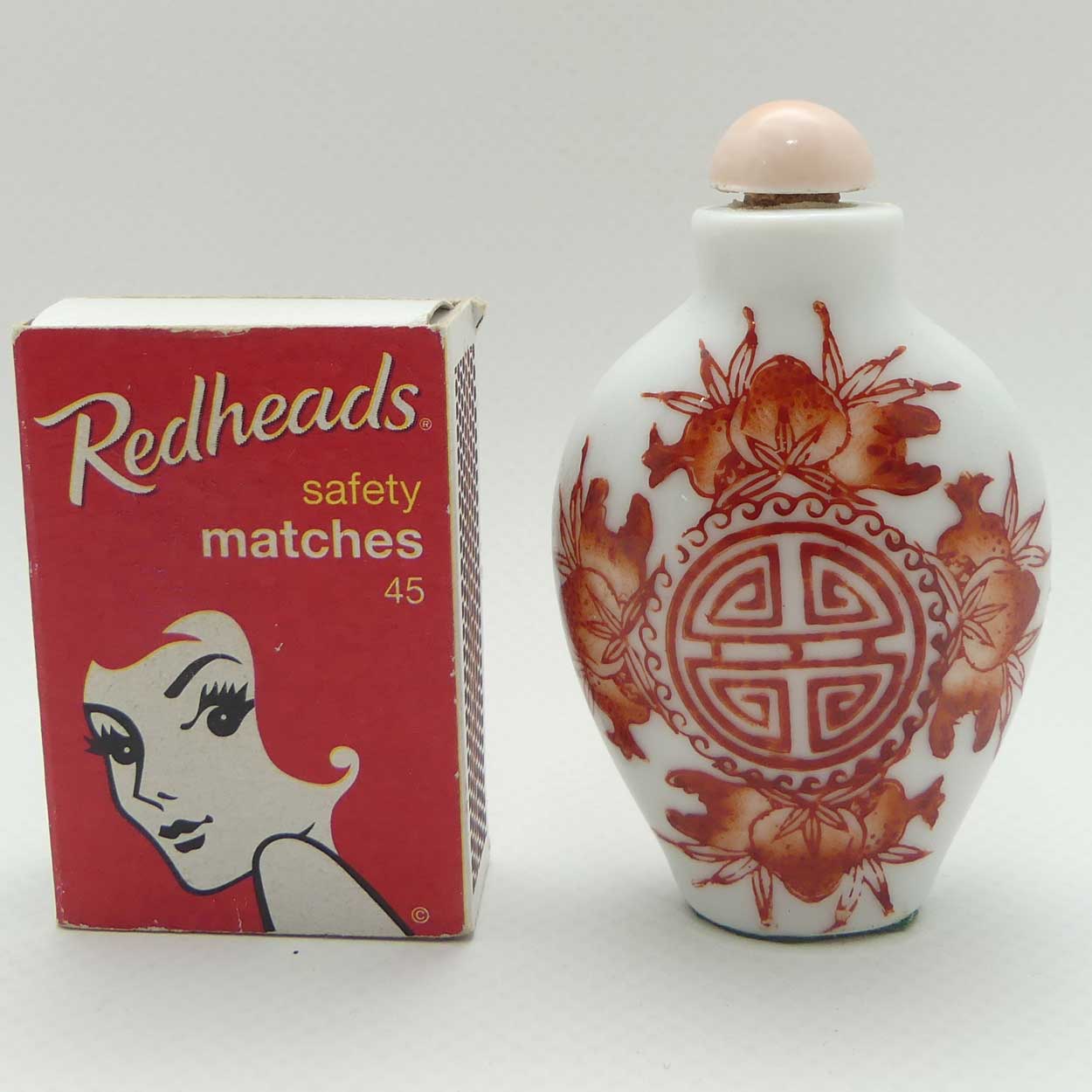 Chinese Red Floral pattern Snuff Bottle | Pink stone stopper