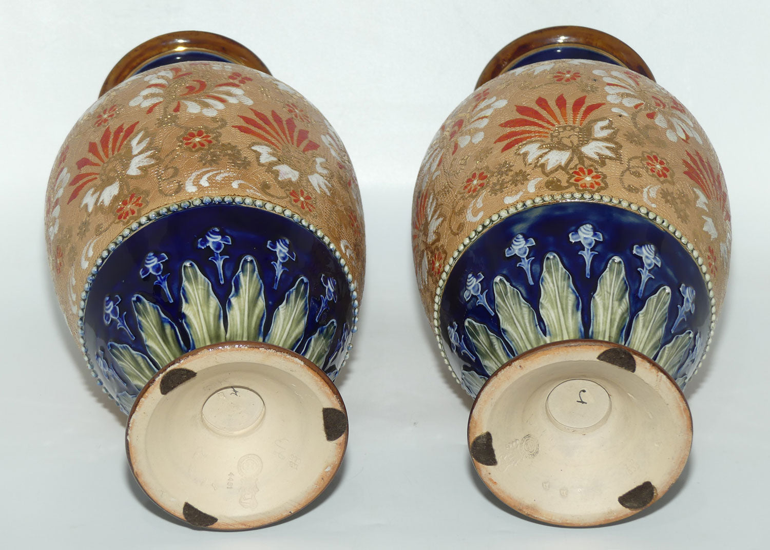 Royal Doulton stoneware pair of bulbous vases with red & white enamelled flowers, gilt highlights, applied leaves & dots (stamped 4461)