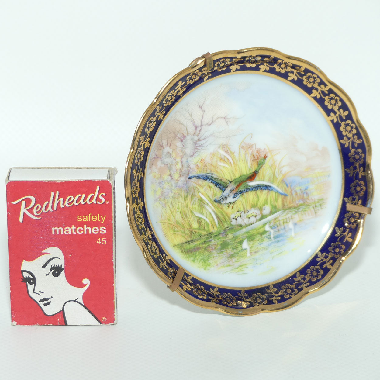 Rehausse Main Limoges France Blue and Gilt border Duck in Flight Scene plate | 9.5cm wide