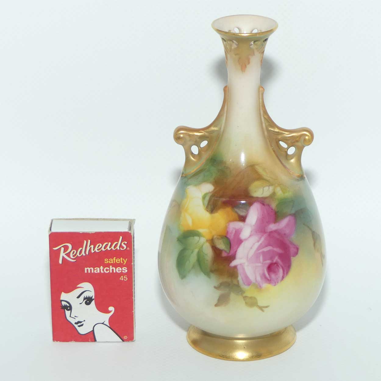 Royal Worcester hand painted Roses twin handle vase with pierced rim