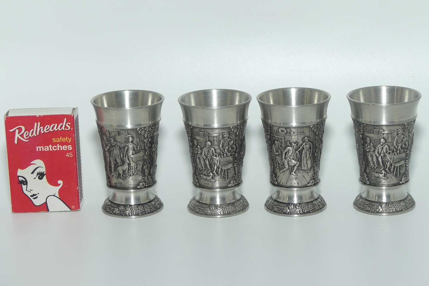 Set of 4 Creation Zinn Pewter well figured shot glasses