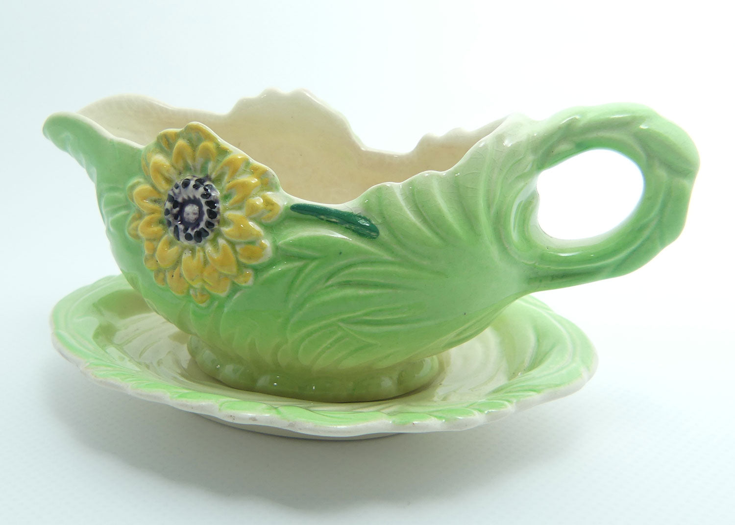 Shorter and Son Staffordshire Floral embossed mayonnaise jug and saucer