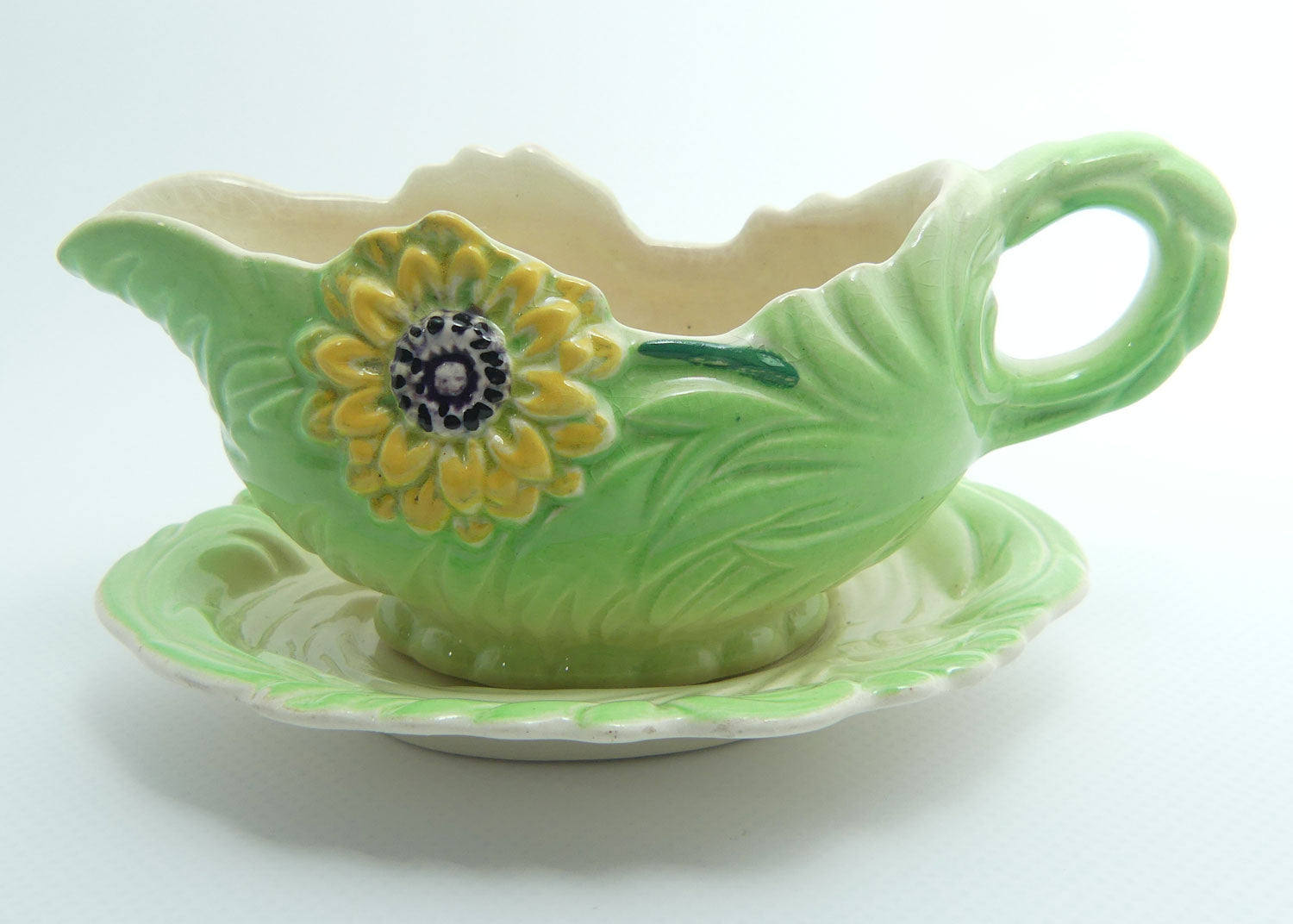 Shorter and Son Staffordshire Floral embossed mayonnaise jug and saucer