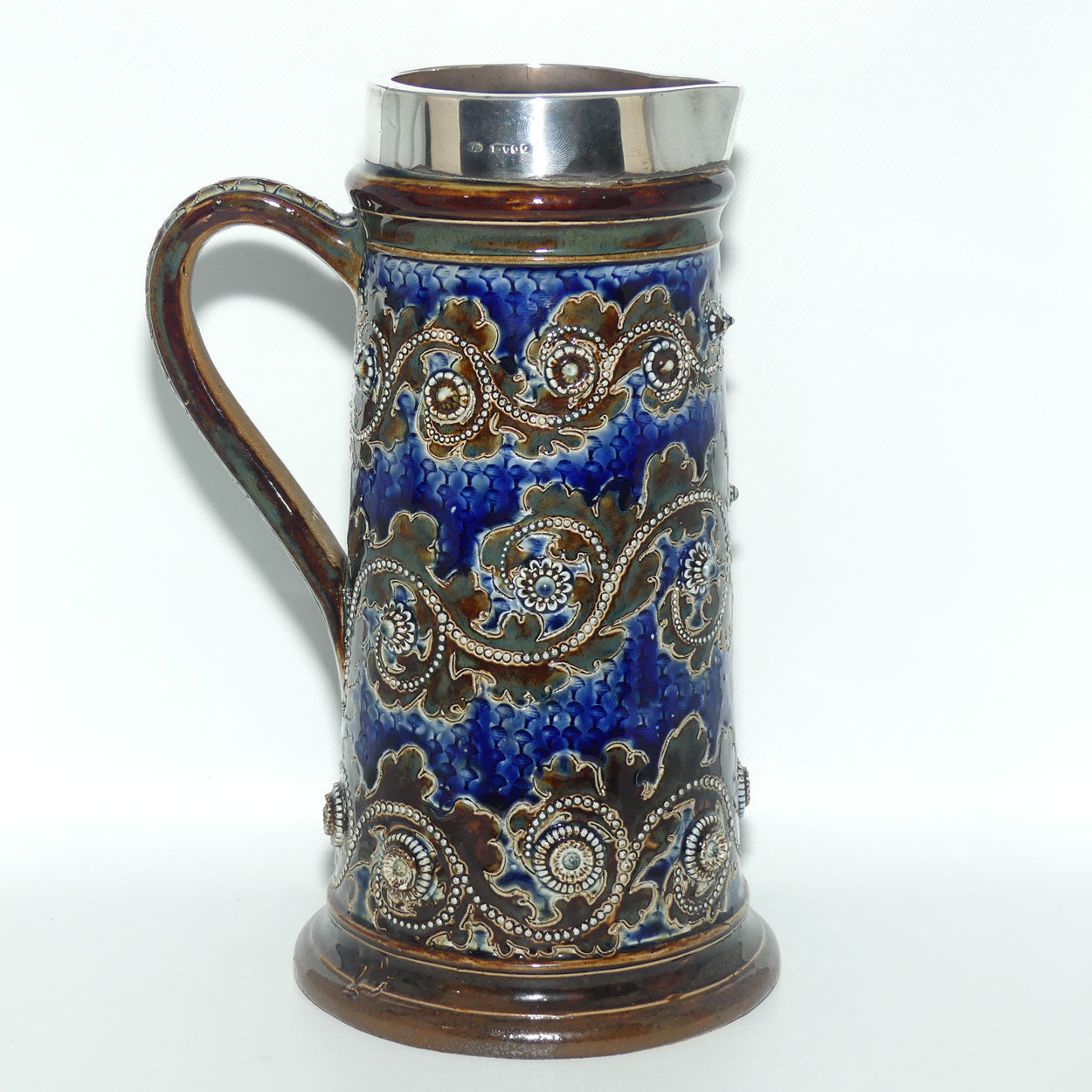 Doulton Lambeth George Tinworth stoneware ale jug with Sterling Silver rim (London 1876)