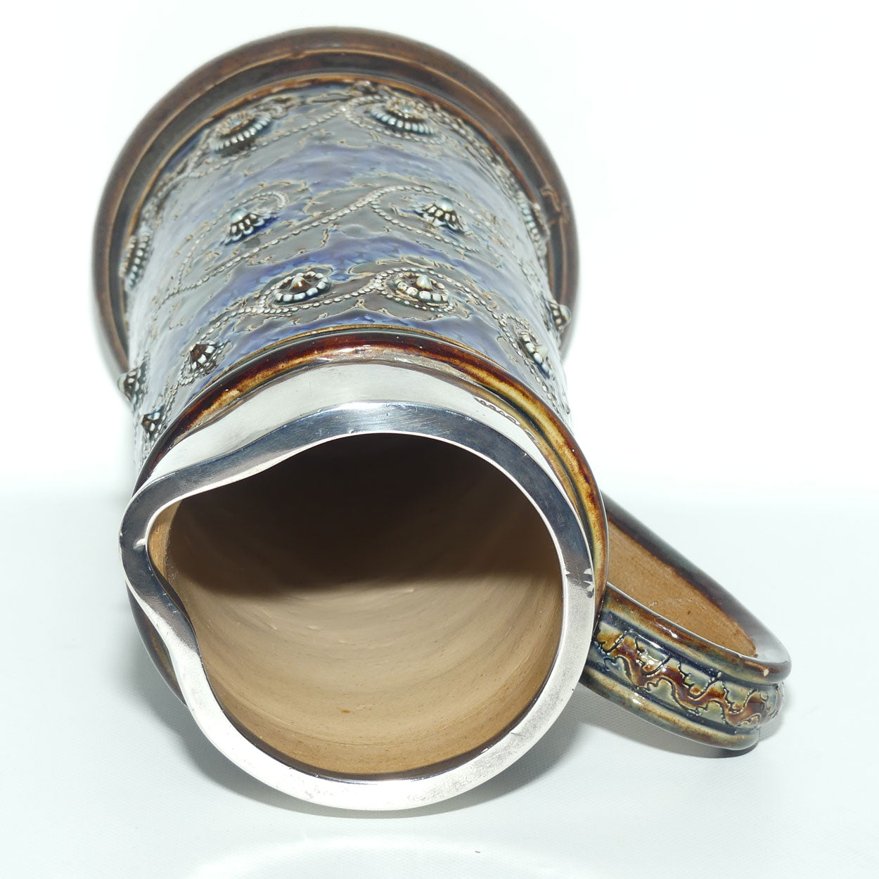 Doulton Lambeth George Tinworth stoneware ale jug with Sterling Silver rim (London 1876)