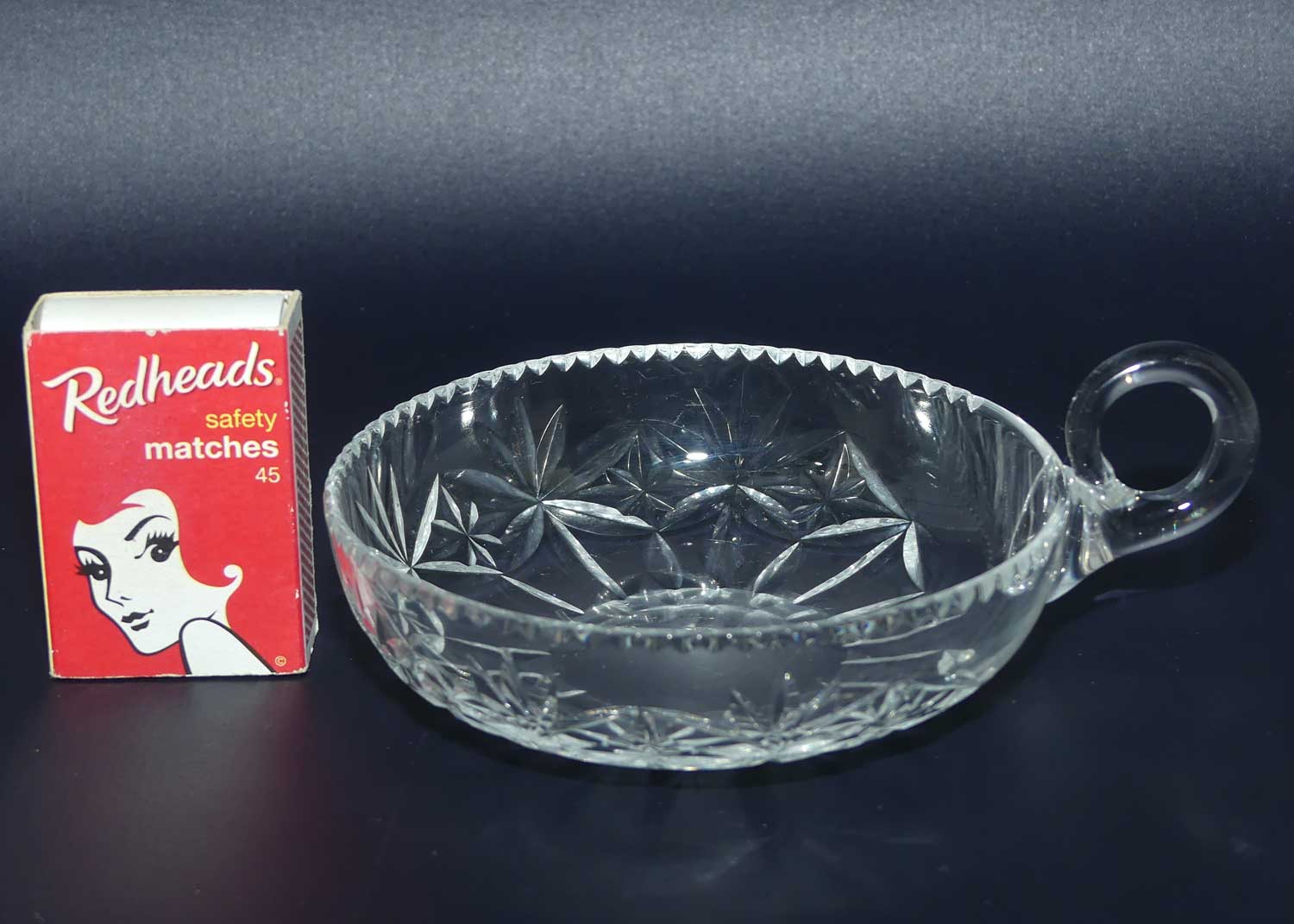 Finely cut single handled crystal server