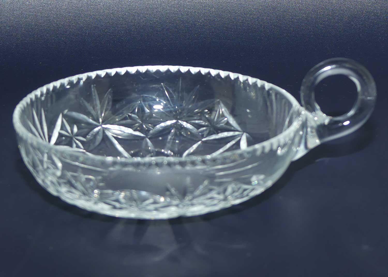 Finely cut single handled crystal server