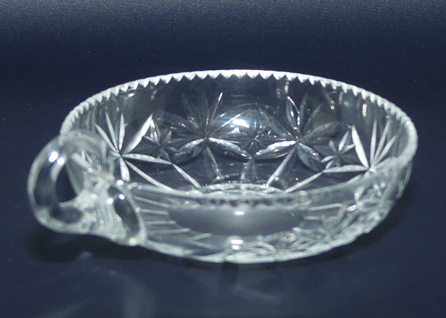 Finely cut single handled crystal server