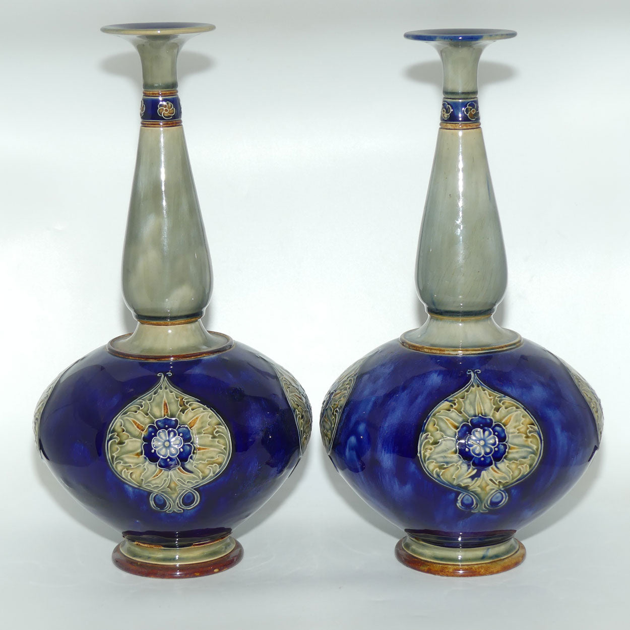 Royal Doulton stoneware pair of tall bulbous vases with applied floral rosettes