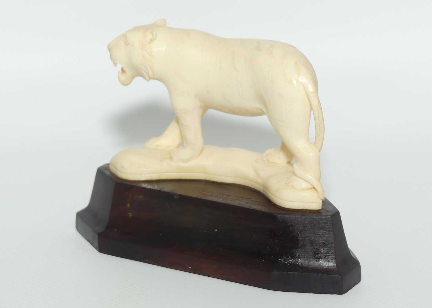 Carved Ivory figure of Tiger Stalking on Rosewood Base
