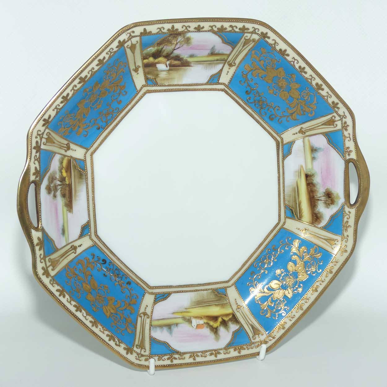 early Noritake Hand Painted and Gilt decorated Blue ground twin handle cake plate | Lake Scene