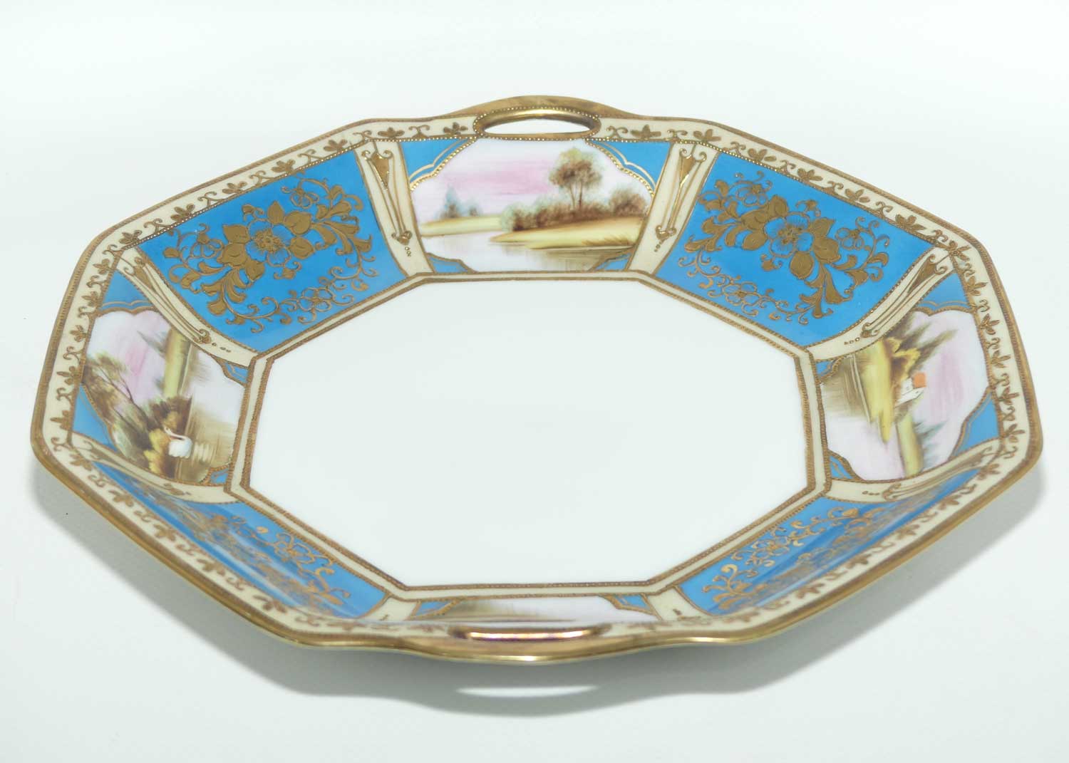 early Noritake Hand Painted and Gilt decorated Blue ground twin handle cake plate | Lake Scene