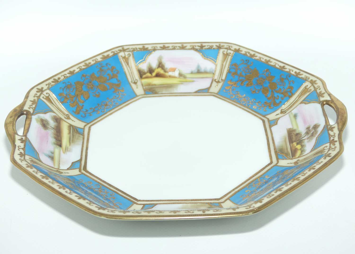 early Noritake Hand Painted and Gilt decorated Blue ground twin handle cake plate | Lake Scene