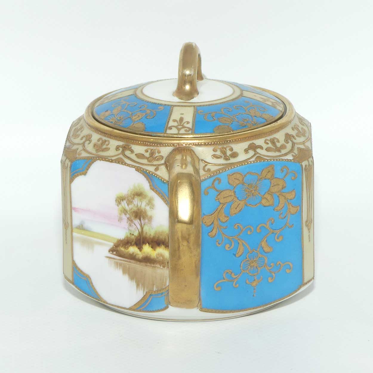 early Noritake Hand Painted and Gilt decorated Blue ground milk and sugar | Hexagonal shape | Lake Scene