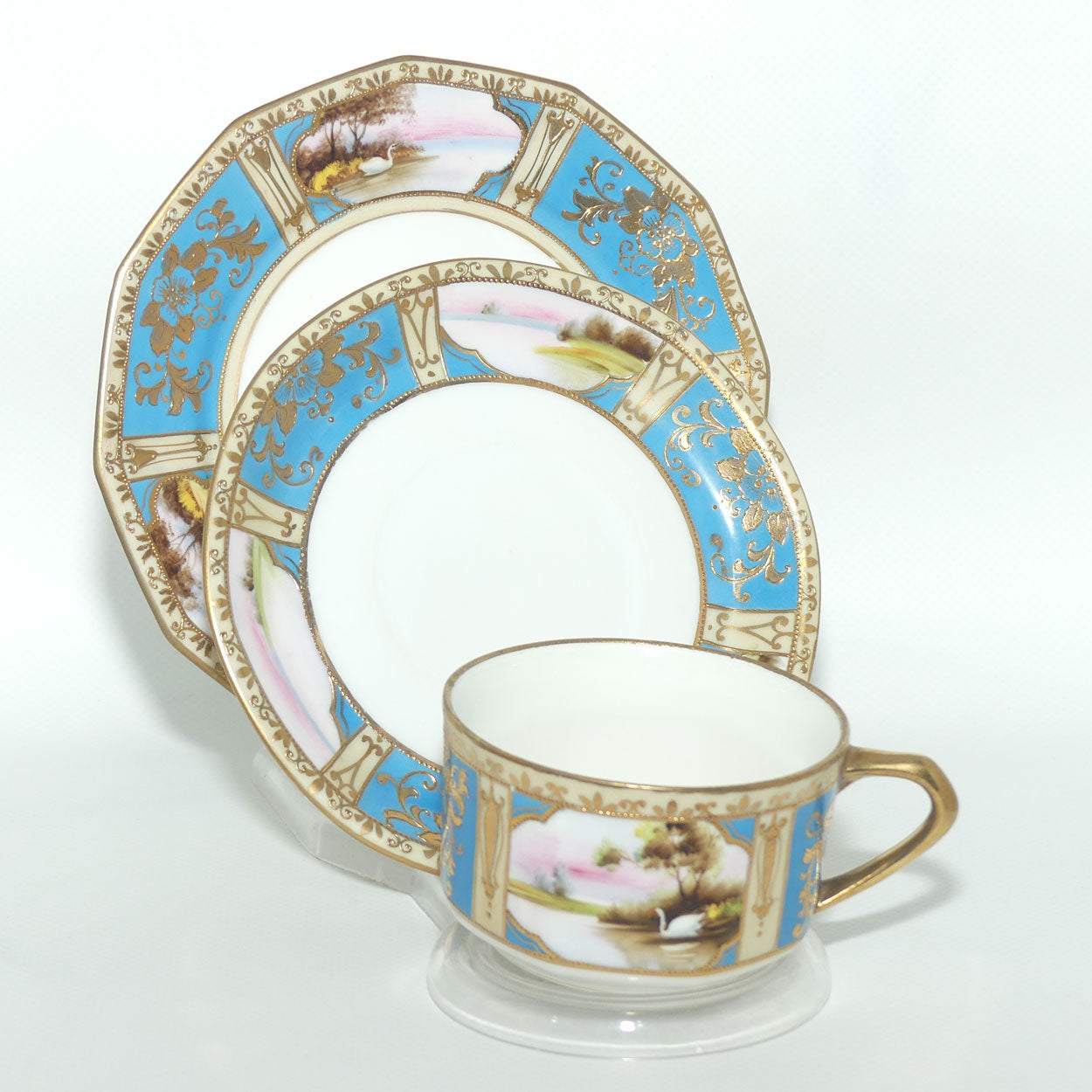 Early Noritake Hand Painted and Gilt decorated Blue ground tea trio | #1 | Lake Scene