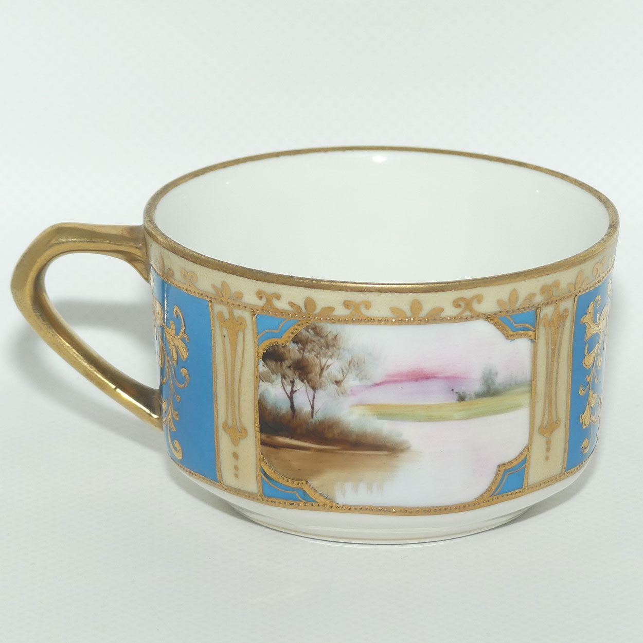 Early Noritake Hand Painted and Gilt decorated Blue ground tea trio | #1 | Lake Scene