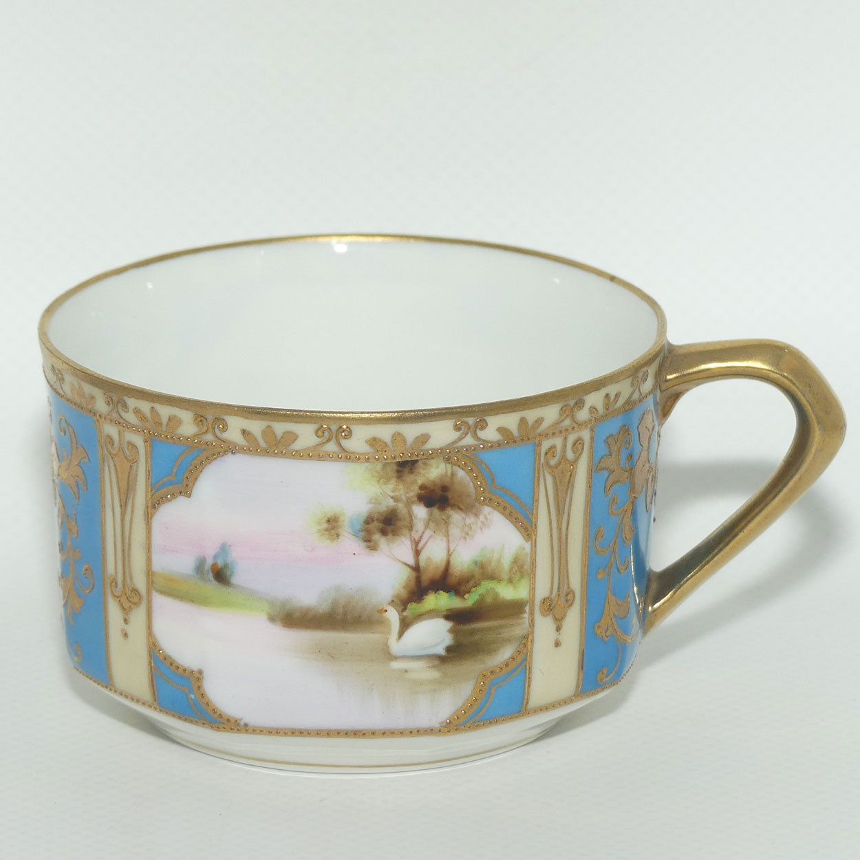 Early Noritake Hand Painted and Gilt decorated Blue ground tea trio | #2 | Lake Scene