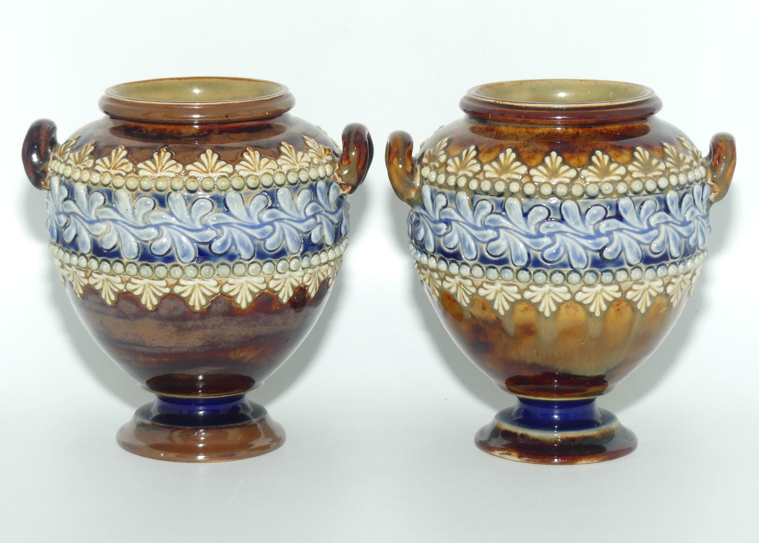 Doulton Lambeth stoneware pair of handled and footed urns (#4505)
