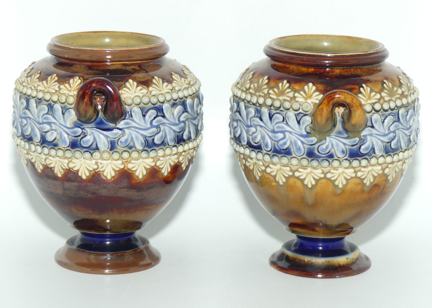 Doulton Lambeth stoneware pair of handled and footed urns (#4505)