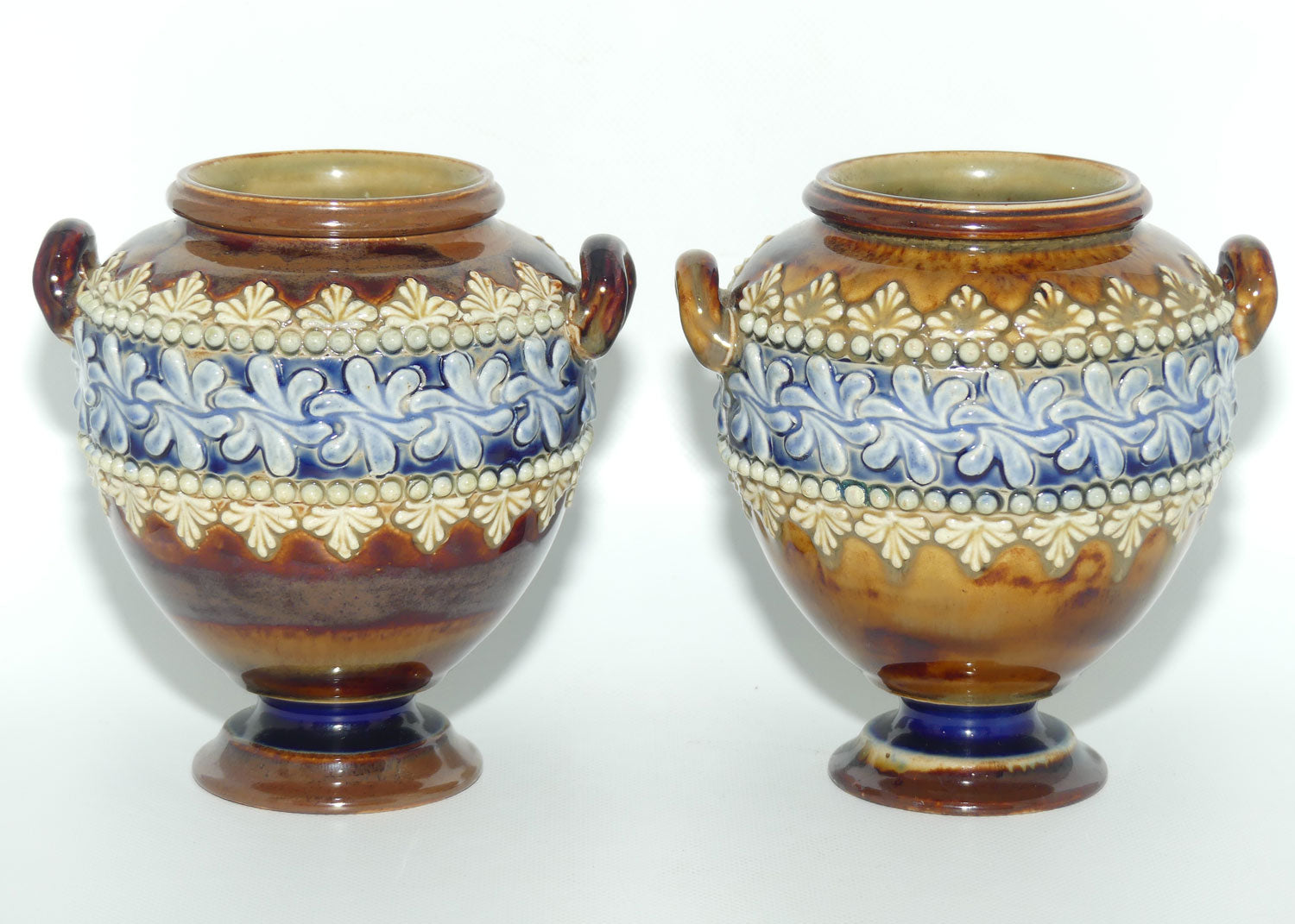 Doulton Lambeth stoneware pair of handled and footed urns (#4505)