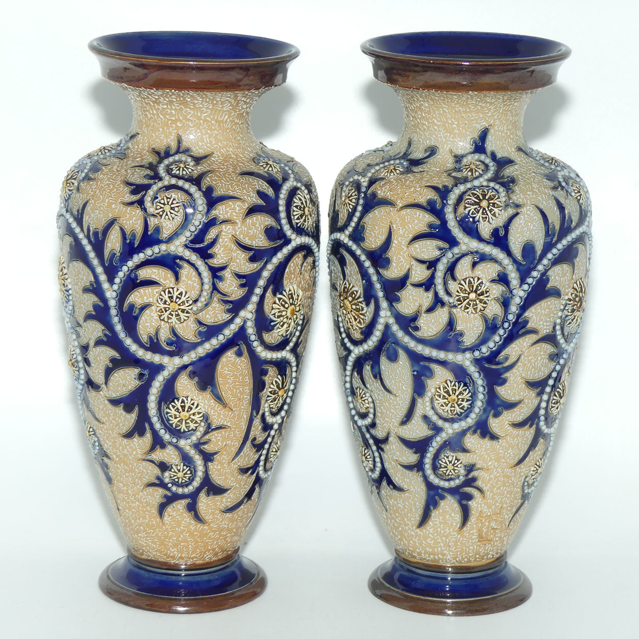 Royal Doulton stoneware George Tinworth pair of bulbous centrepiece vases with applied baguette beads and foliage