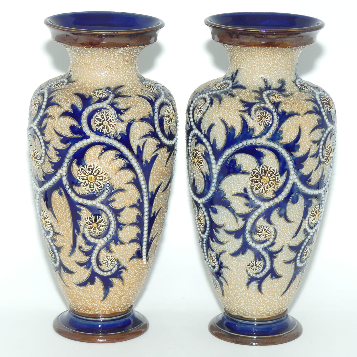 Royal Doulton stoneware George Tinworth pair of bulbous centrepiece vases with applied baguette beads and foliage