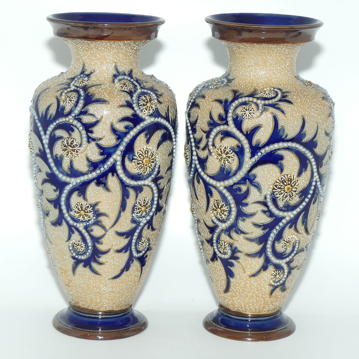 Royal Doulton stoneware George Tinworth pair of bulbous centrepiece vases with applied baguette beads and foliage