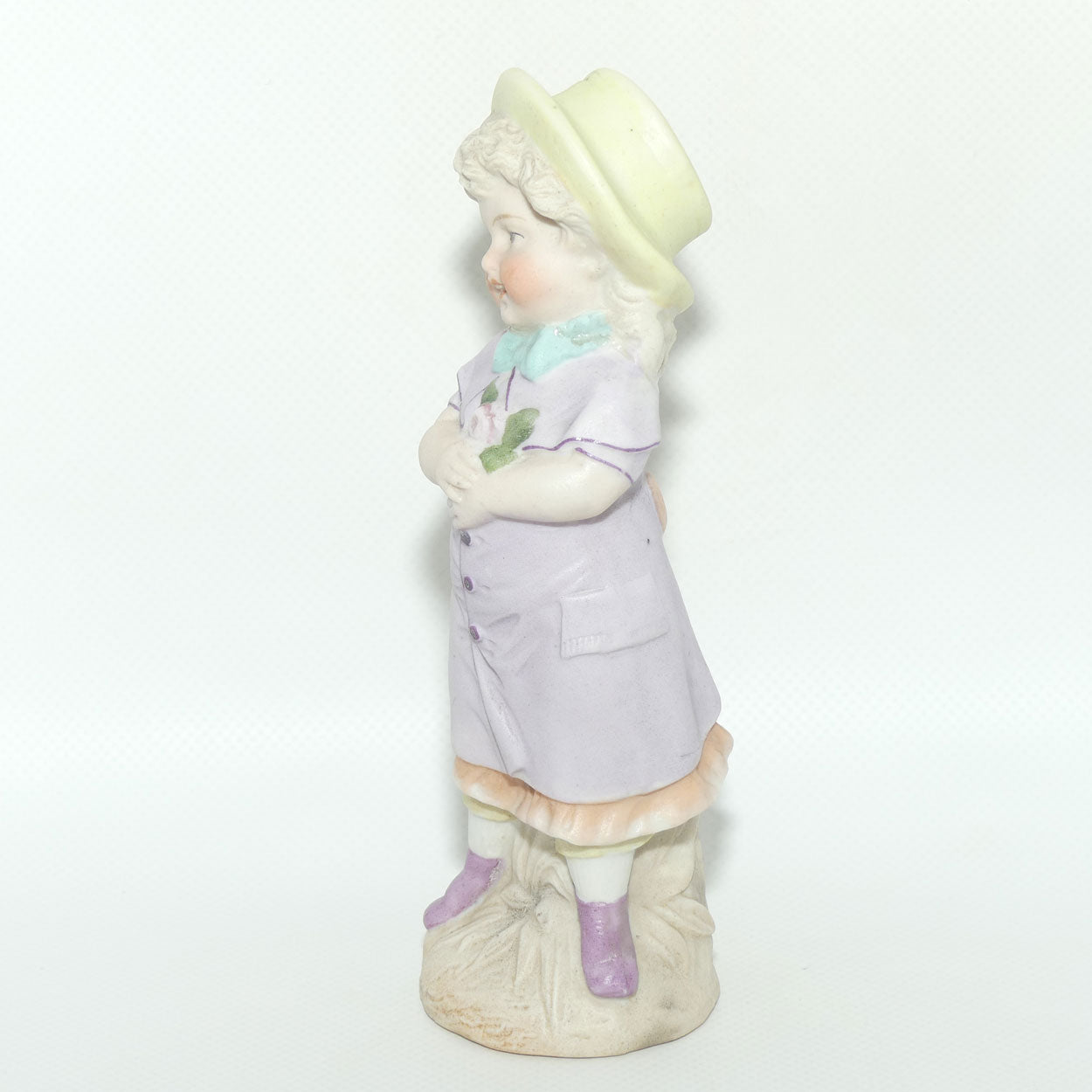 Victorian era Bisque figure of a Girl in Yellow Bonnet