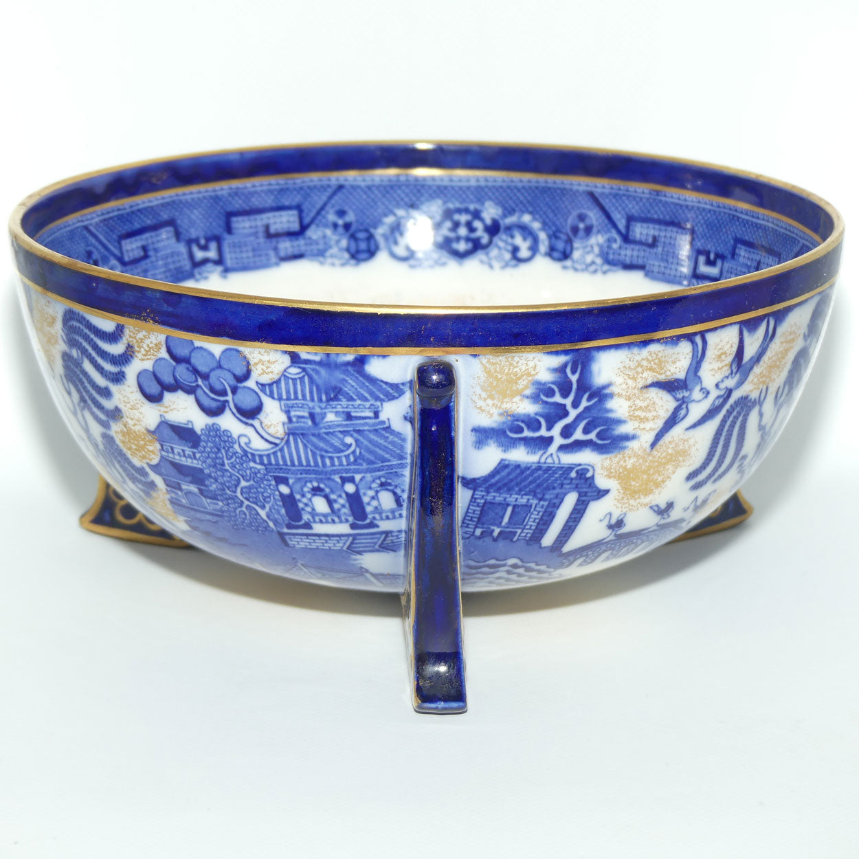 Doulton Burslem England Flow Blue Willow bowl on figured feet | unmarked