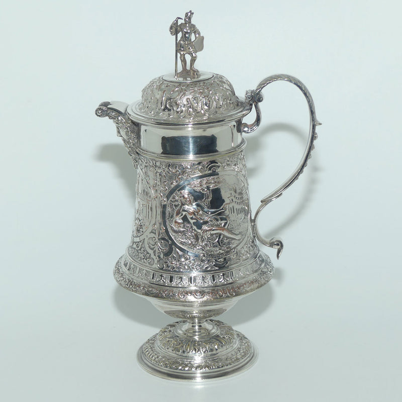 John Grinsell and Sons Silver Plate Heavily decorated Wine Jug with mo ...