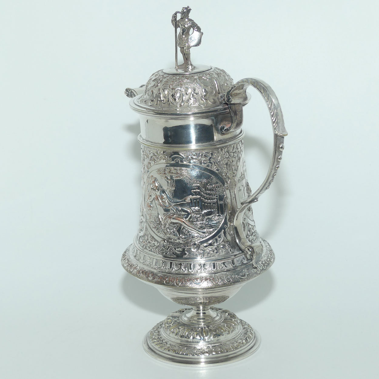 John Grinsell and Sons Silver Plate Heavily decorated Wine Jug with motto Patientia Solertia Nolvi