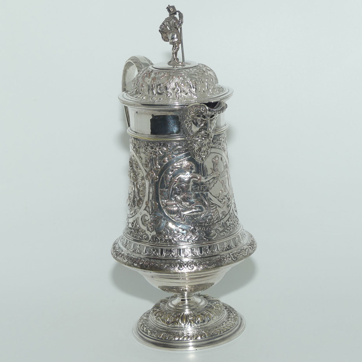 John Grinsell and Sons Silver Plate Heavily decorated Wine Jug with motto Patientia Solertia Nolvi