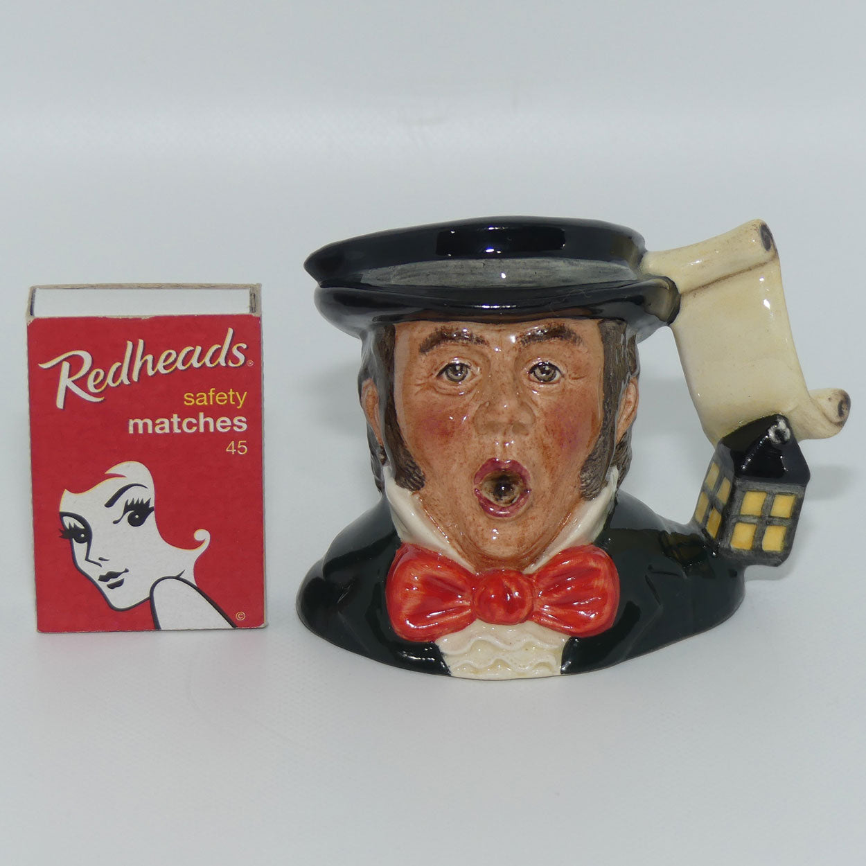 D7007 Royal Doulton miniature character jug The Caroler