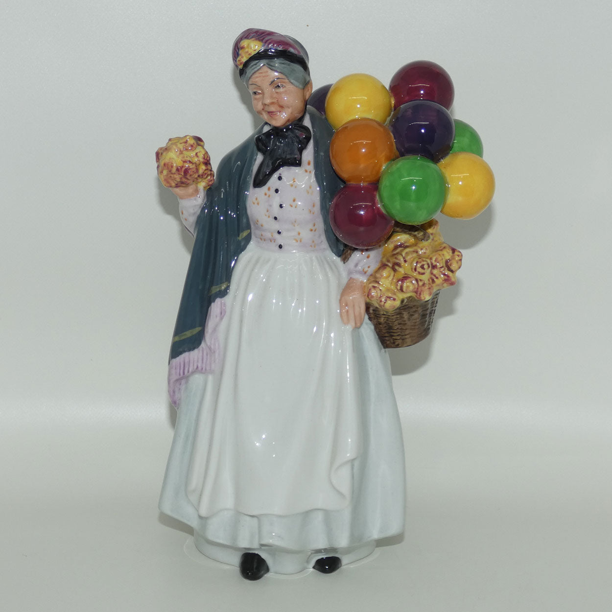 HN1843 Royal Doulton figure Biddy Penny Farthing | later stamp