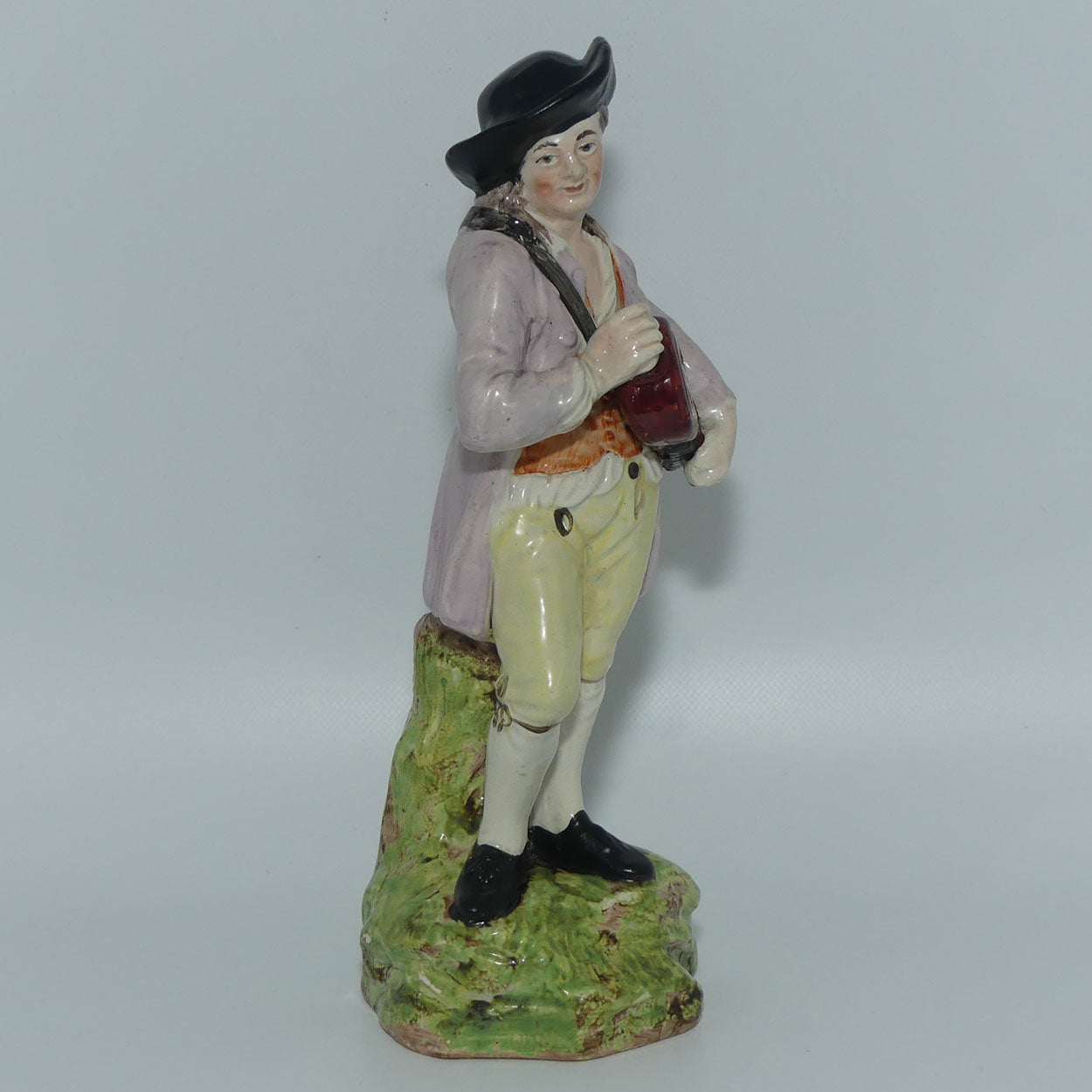 19th Cent English Pottery Man in Hat Carrying Instrument