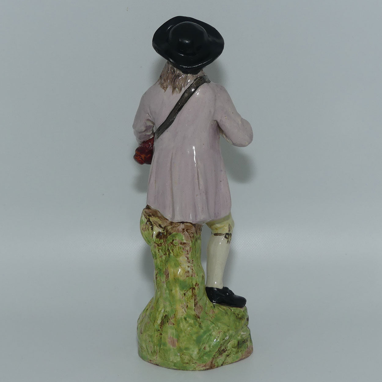 19th Cent English Pottery Man in Hat Carrying Instrument