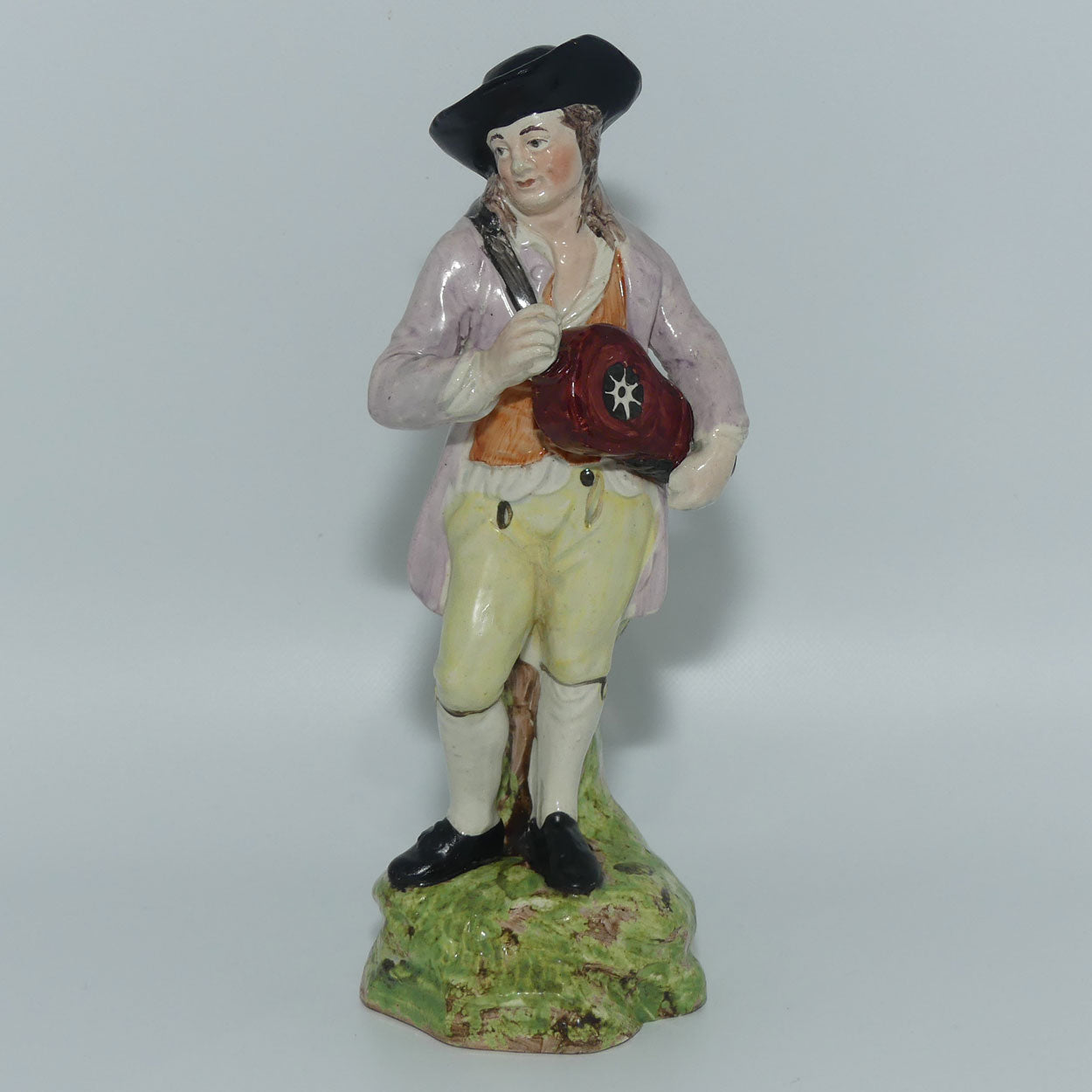 19th Cent English Pottery Man in Hat Carrying Instrument